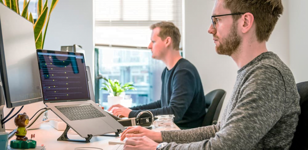 Support team at work in office