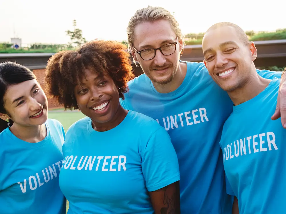 group of happy volunteers Group of happy volunteers